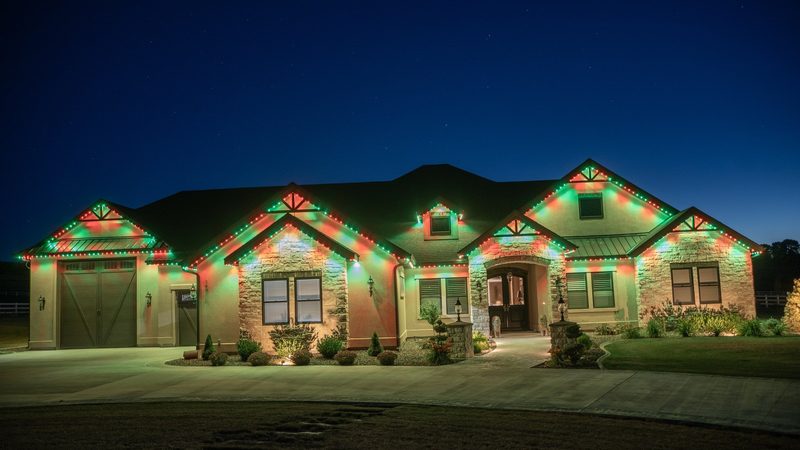 A home lit in full holiday color