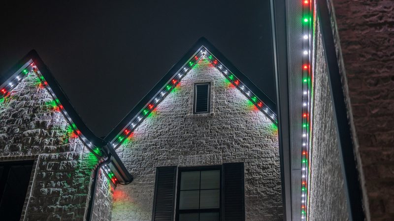 A roofline lit in red and white