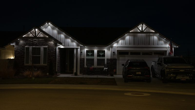 An arched entry lit at dusk
